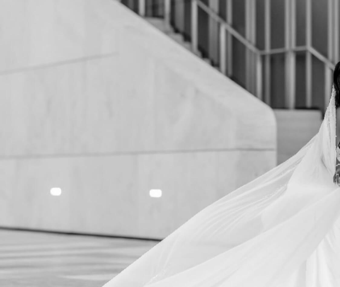 Model wearing a white dress. Background image
