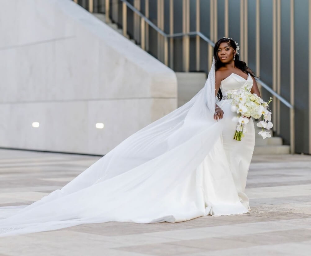 Model wearing a white dress