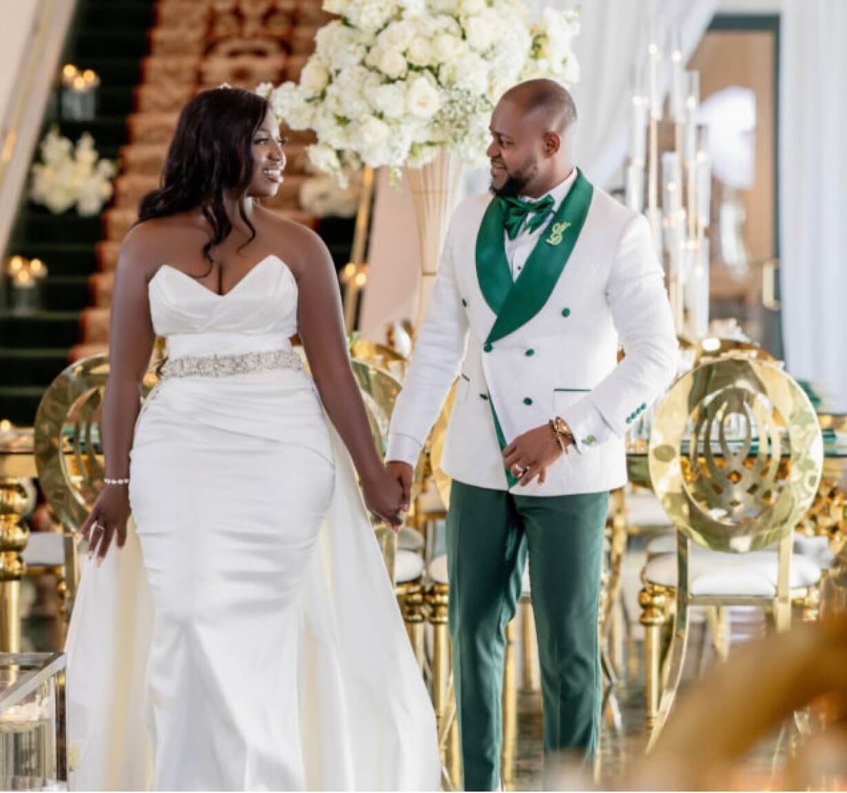 Сouple wearing a white gown and a white suit