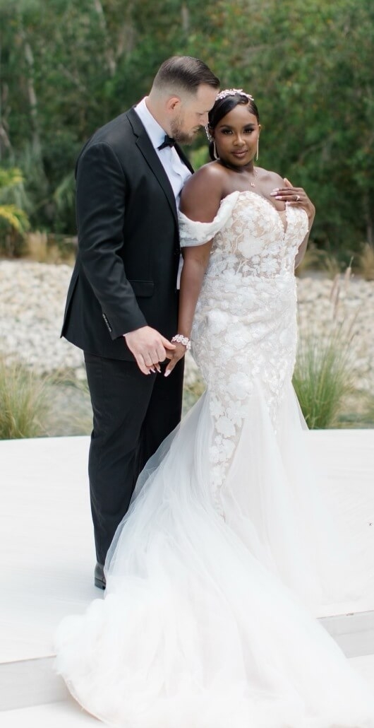Couple wearing a white gown and a black suit