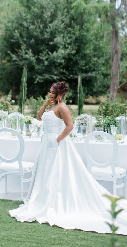 Model wearing a white bridal gown